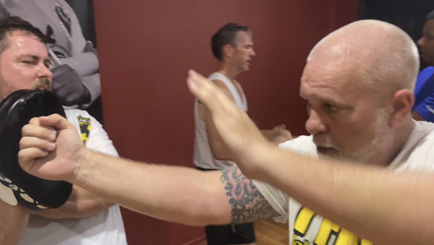 Tampa Martial Arts and Self-Defense, Student training on martial arts technique during class.