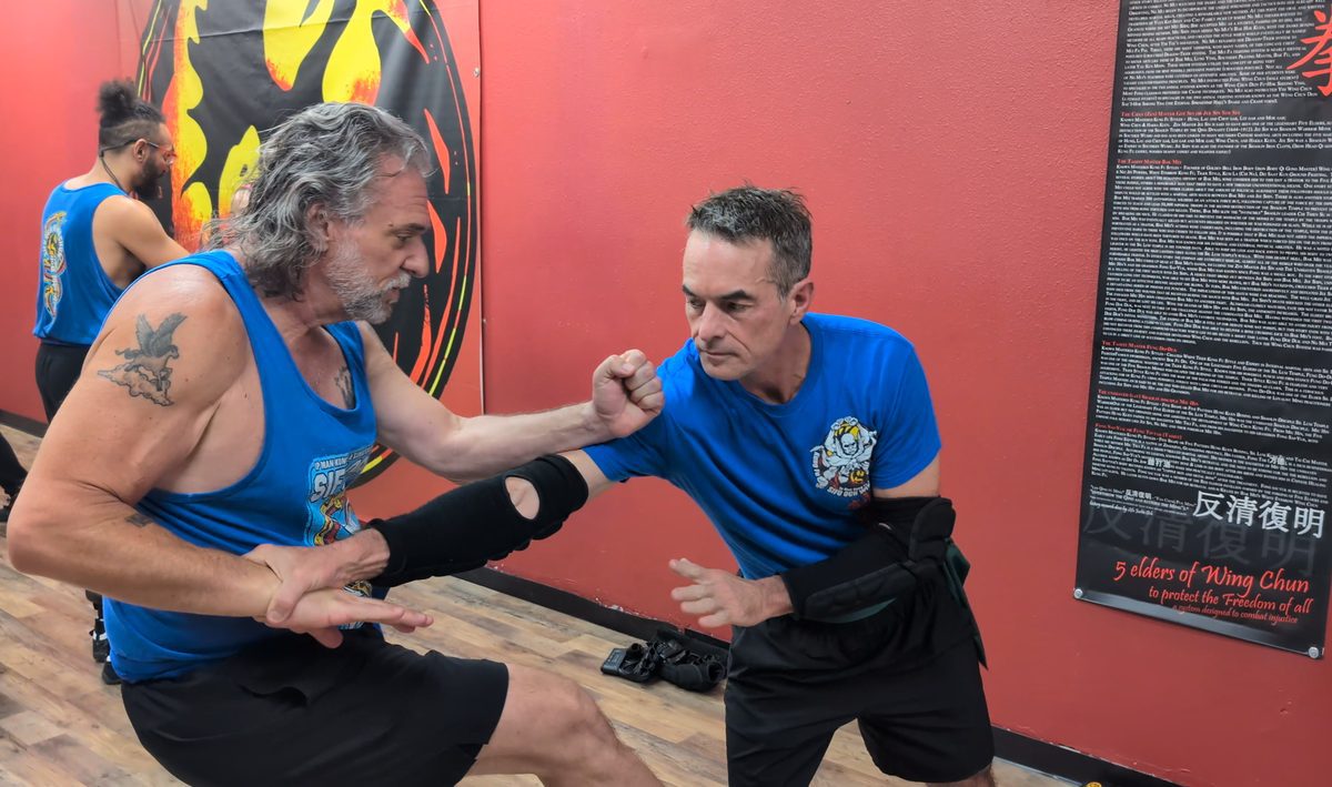 Two adult students practicing a close-range Wing Chun partner drill at Tampa Wing Chun Kung Fu